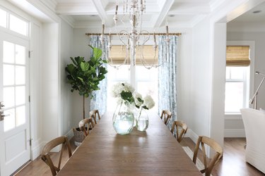 dining room decor idea with white walls and chandelier