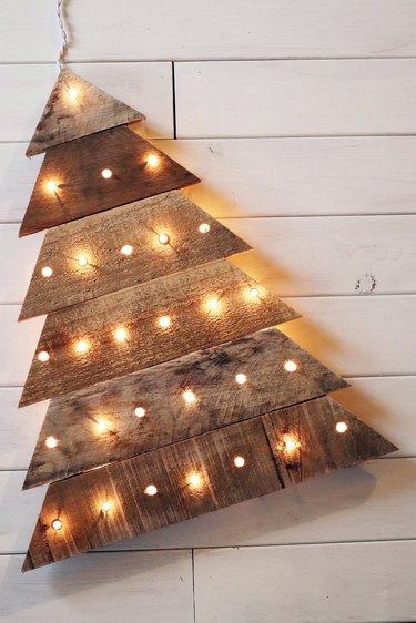 Pallet Christmas tree with twinkling lights in reclaimed wood