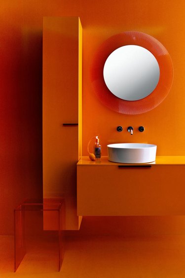 modern orange kartell bathroom