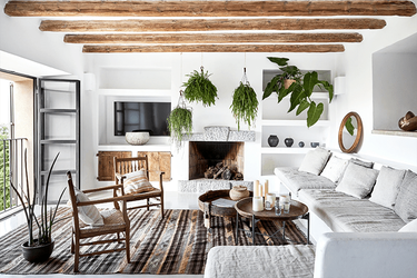 mediterranean style living room with wood ceiling beams