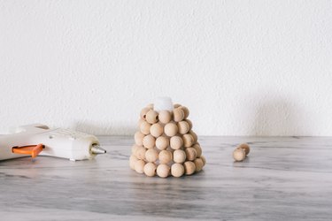 Gluing rows of beads to foam cone