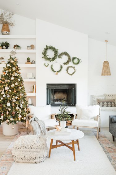 Christmas Tree Themes with Living room fireplace with Christmas tree and boho decor