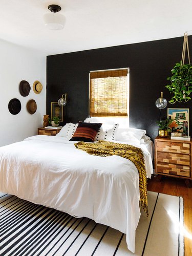 bohemian bedroom with black accent wall