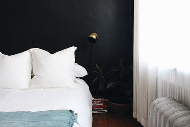 minimalist bedroom with black walls