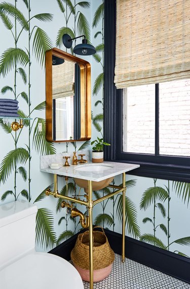 color that goes with navy blue, powder room with green and blue palm wallpaper