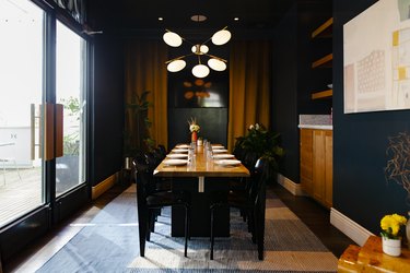 A dark green dining room
