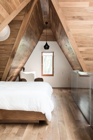 bedroom attic idea with wood ceiling and floors