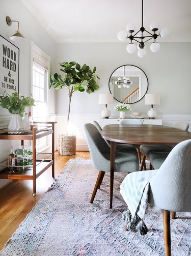 Modern gray dining room idea with natural light and gray walls