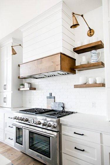 white farmhouse kitchen with shiplap walls and white subway tile backsplash