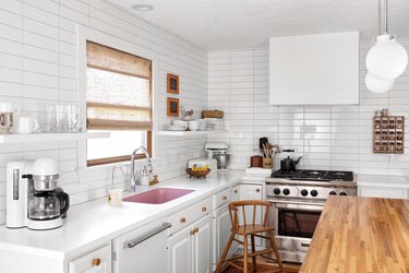 white subway tile kitchen backsplash in straight line