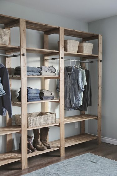 Freestanding industrial pipe closet idea in wood