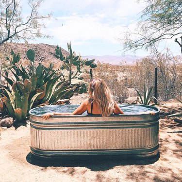 oval stock tank pool in the desert