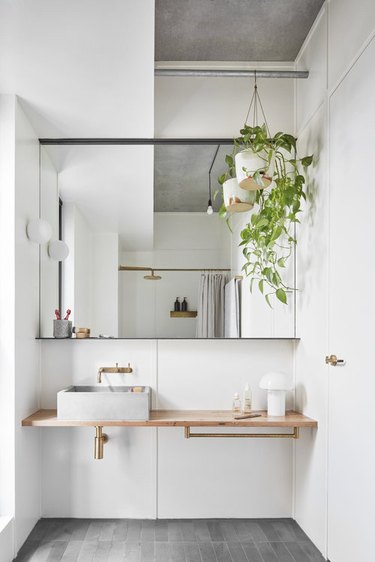 Scandinavian bathroom with vessel sink and floating vanity