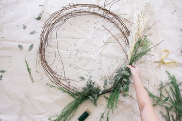 Attaching floral bundles to wreath