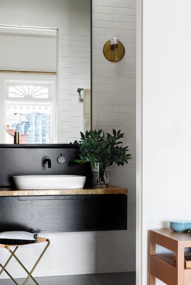 Scandinavian bathroom with shiplap wall and floating vanity