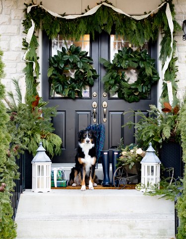 DIY Outdoor Christmas Decorations with garland and black door
