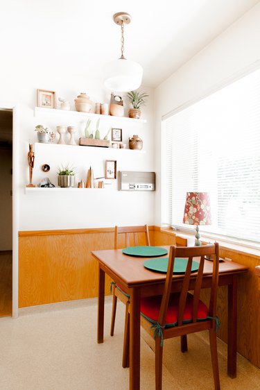 Dining room nook with wood table and chairs.