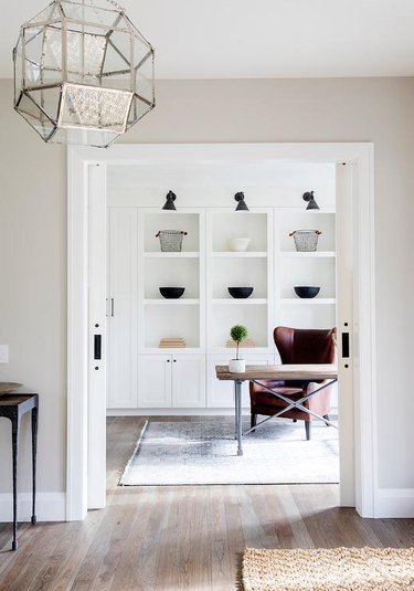 Home Office Doors with Pocket doors in a home office by Amber Interiors