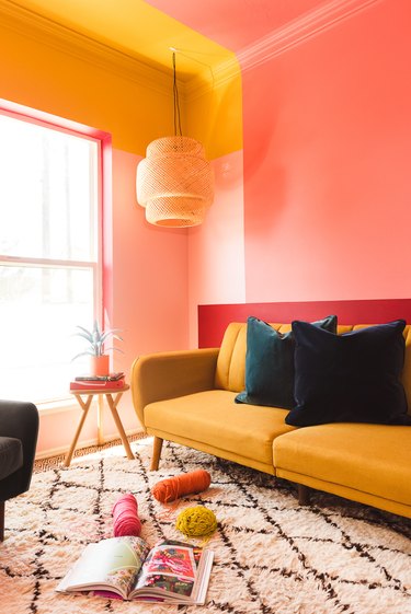 guest room with warm colors and a bamboo pendant light