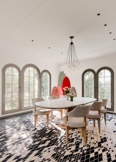 white dining room with arched windows