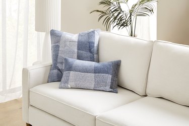white sofa with denim pillows