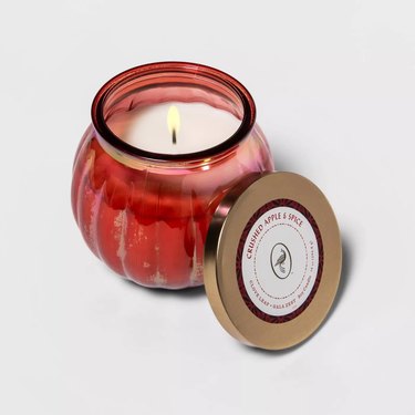 candle in red glass holder