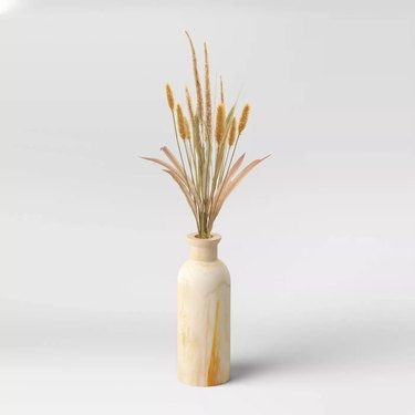 artificial foxtail arrangement in wood vase