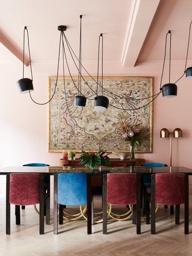 pink dining room with pendant lighting