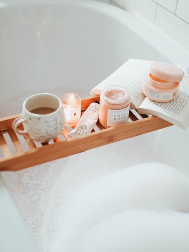 bubble bath with bathtub tray and mini candle