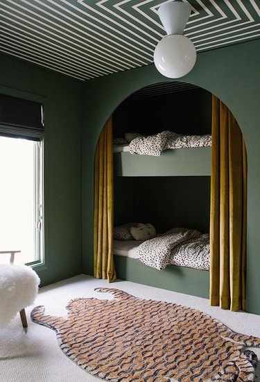 forest green bedroom color idea with bunk beds and patterned ceiling