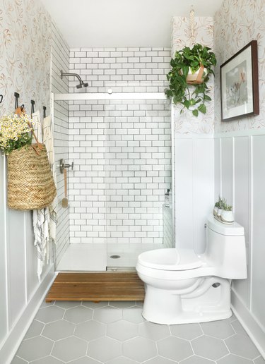 bathroom idea with white subway tile in shower and hexagonal floor tile