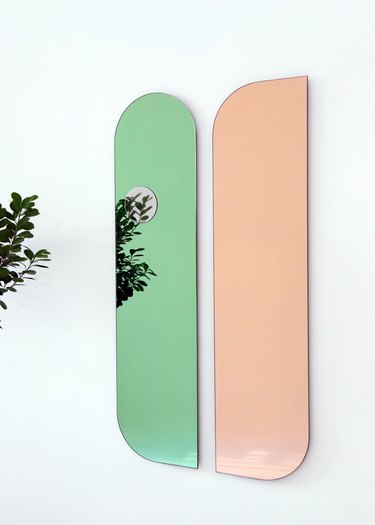 two mirrors in green and peach colors