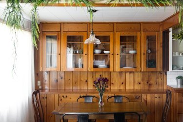 dining room with wood cabinets and dark able