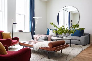 bauhaus colors in living room with leather chaise and grey sofa