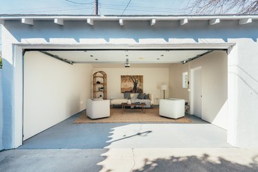 Garage Organization Tips and Tricks in white garage with jute rug