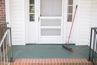 Concrete porch swept clean with a broom