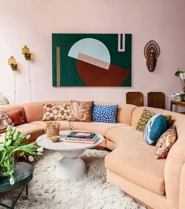 bauhaus colors in living room with pink walls and abstract art