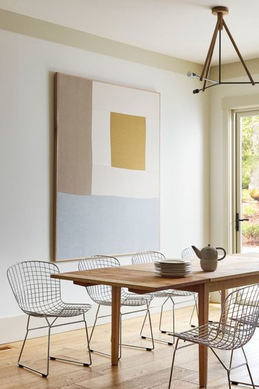 dining room design idea with artwork used to define space