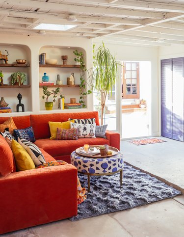 Garage Organization Tips and Tricks with orange couch and built-ins