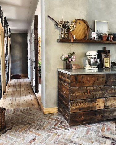 rustic kitchen with dark wood cabinets and open shelving