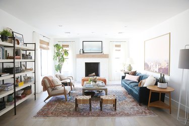 white living room with a subtle tile pattern over the fireplace