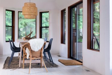 neutral dining room color idea with IKEA pendant above table