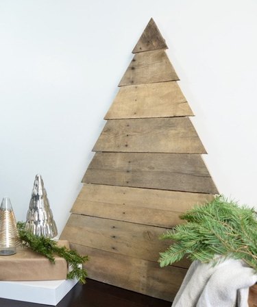 Modern Christmas Decor with Reclaimed wood Christmas tree shaped wall piece.