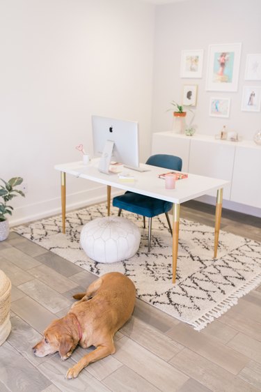 Feng Shui Home Office in boho glam home office with patterned rug and green chair