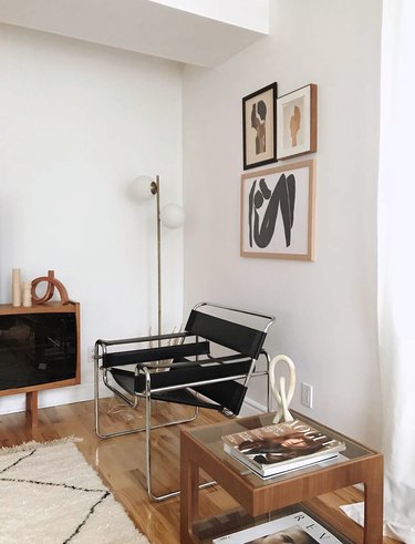 minimal living room with bauhaus chair and small gallery wall