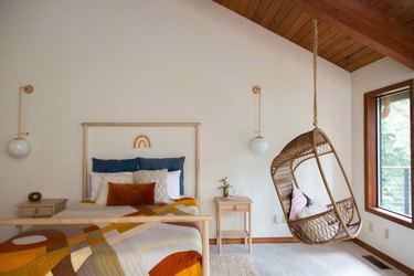 bedroom with hanging chair