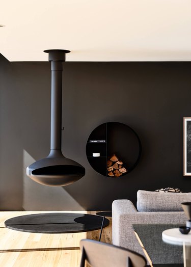 modern home with black hanging fireplace