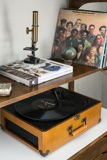 A microscope, record player, and records in Kawalek and Navarro's home