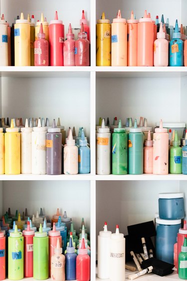 paints in shelves