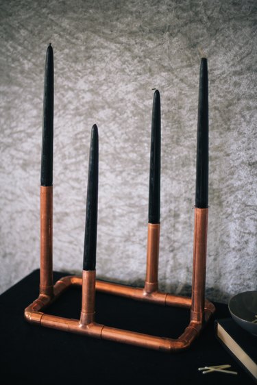 Candles added to copper candelabra